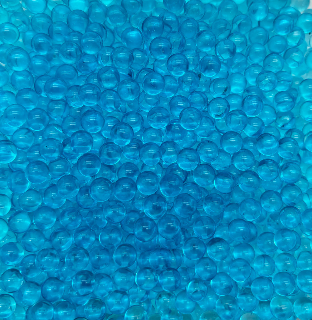 a bunch of blue bubbles sitting on top of a table
