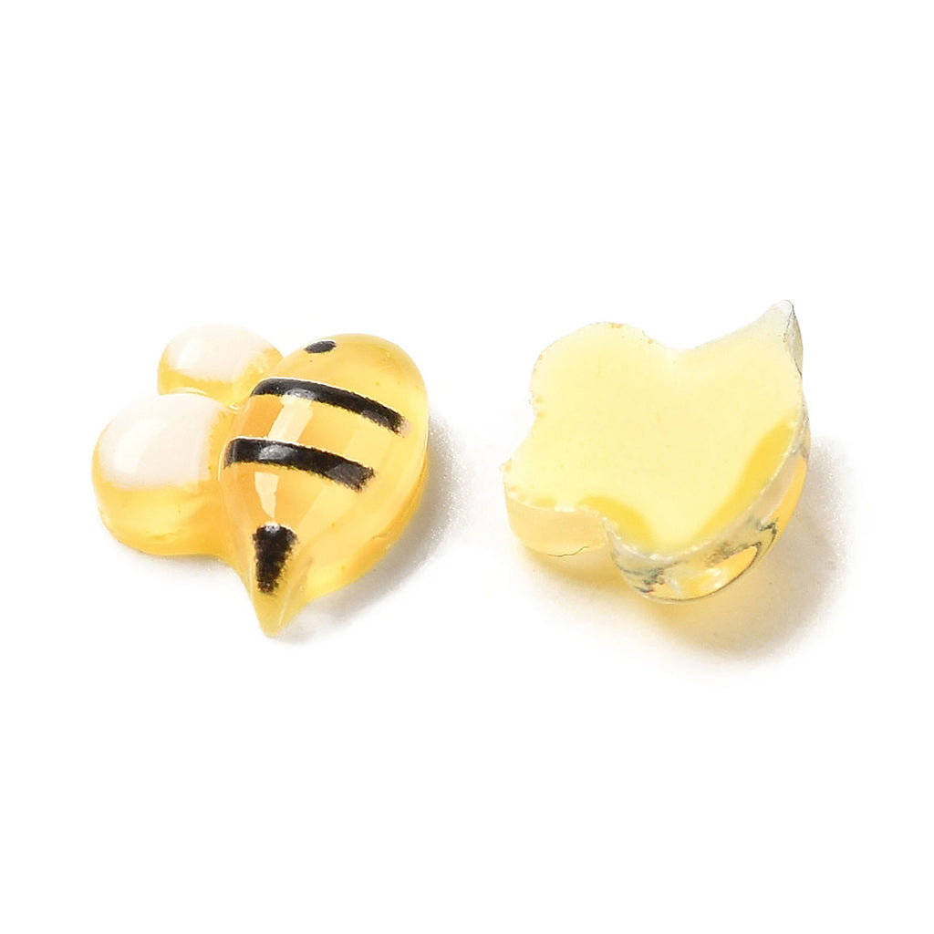 a couple of yellow and black bees next to each other