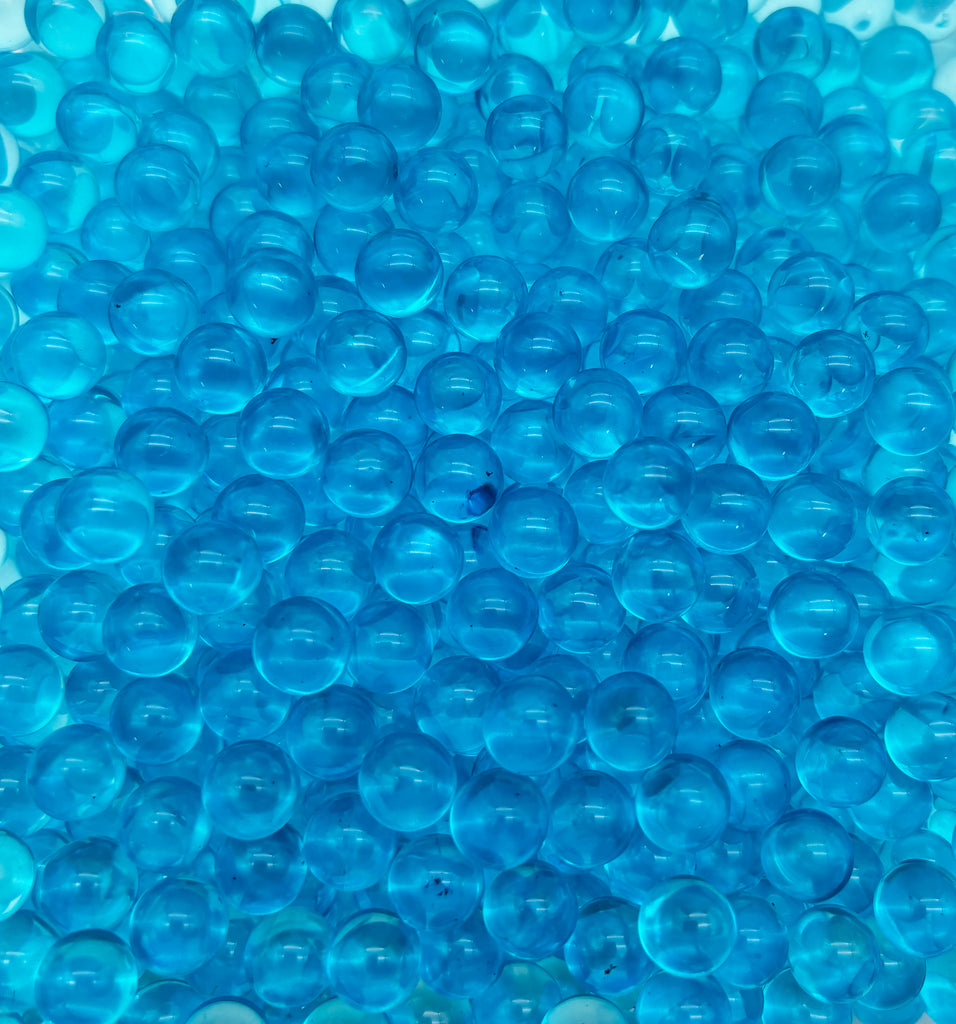 a large amount of blue bubbles in a bowl