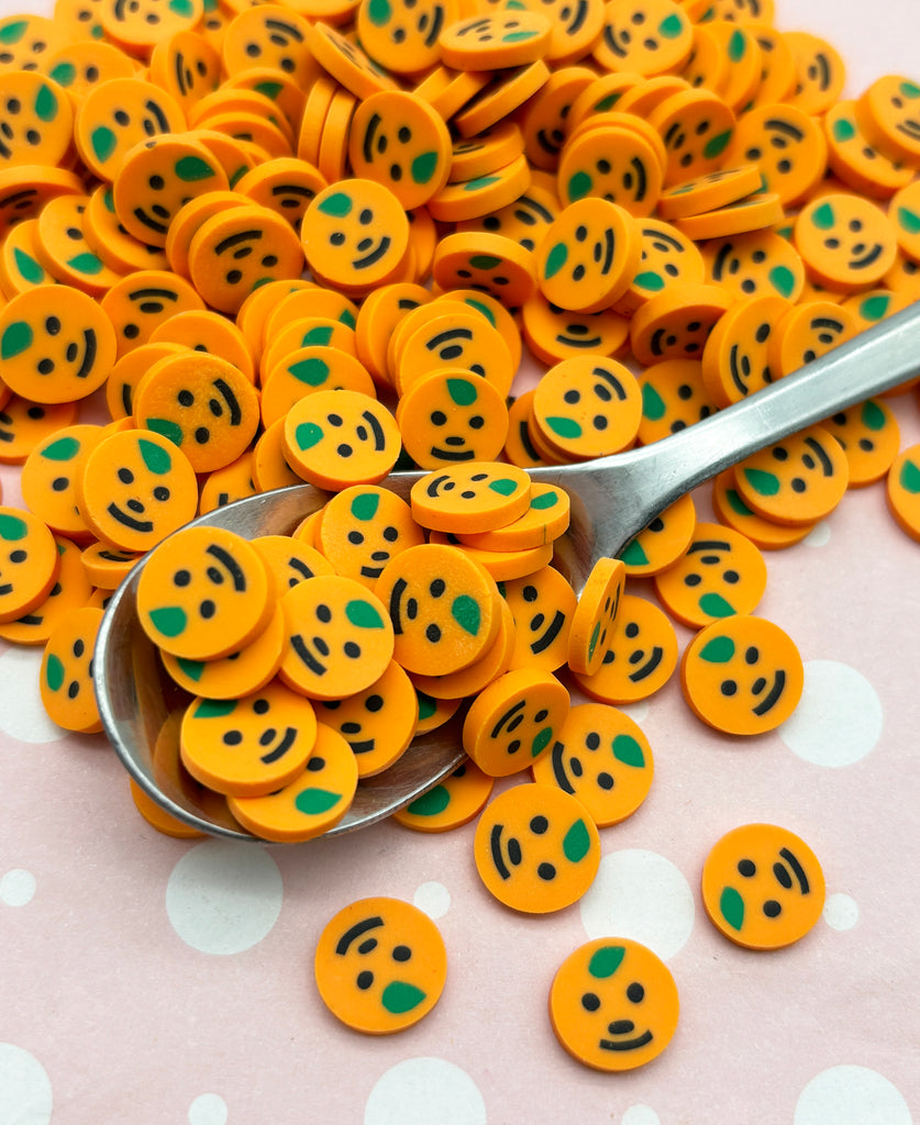 a spoon full of yellow smiley face buttons