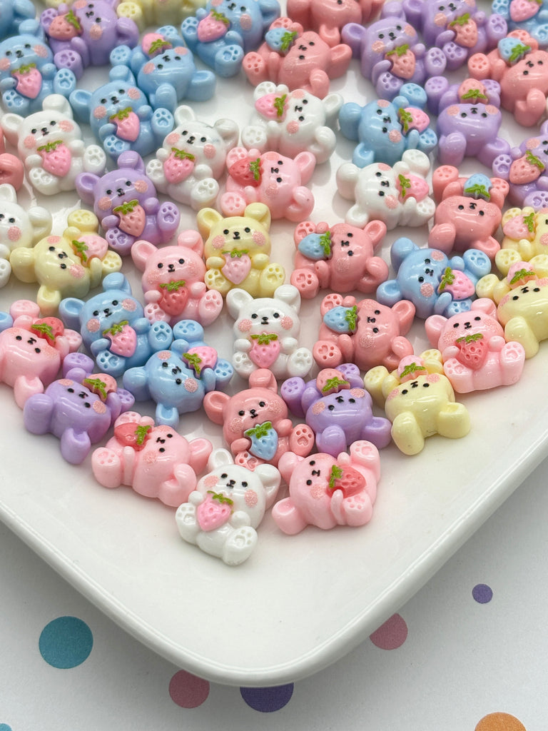 a white plate topped with lots of small teddy bears