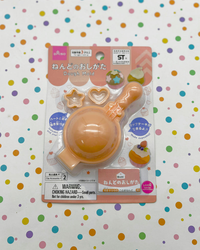 a plastic toy with a baby pacifier in it's mouth