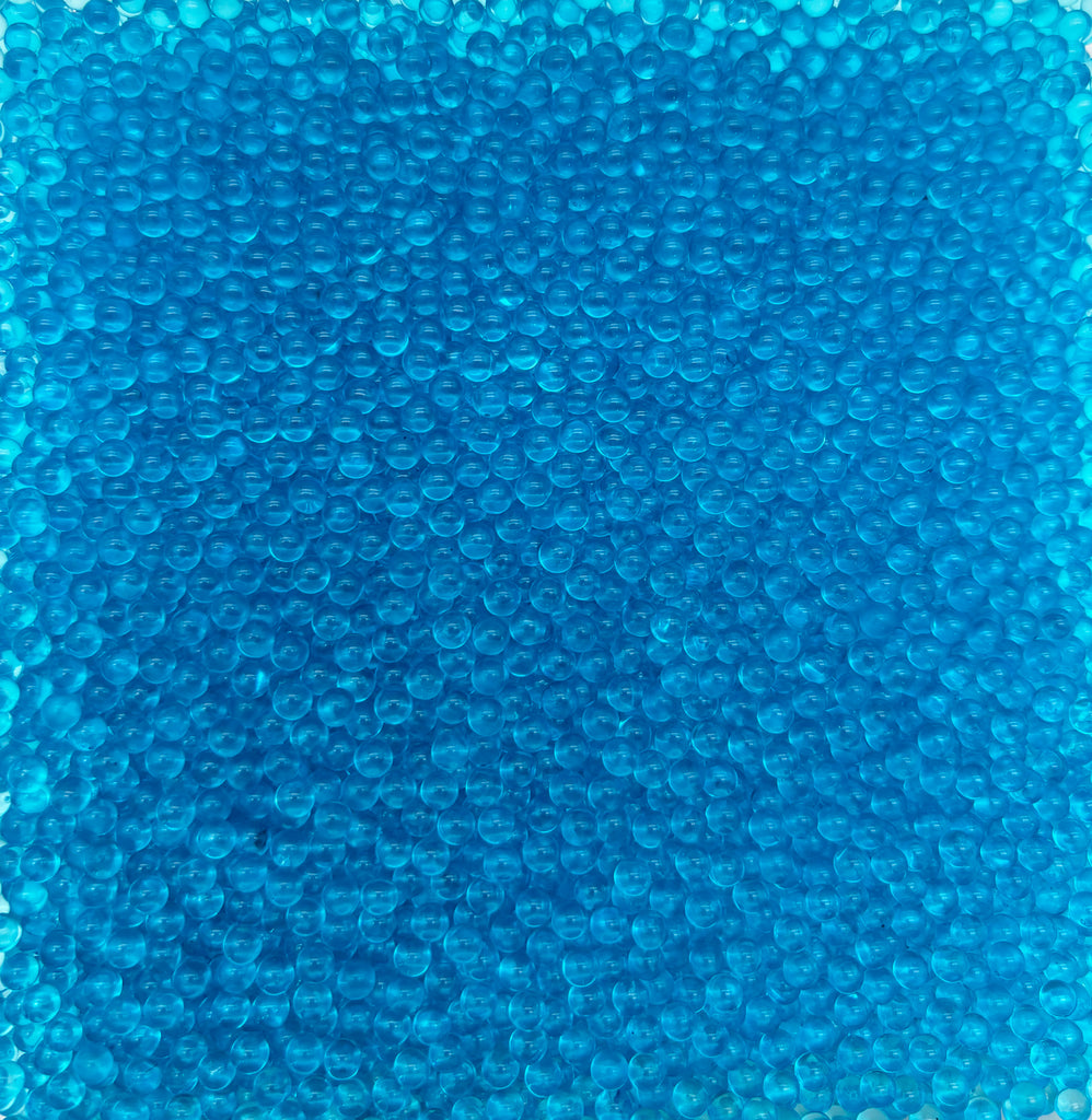 a close up of a piece of blue glass