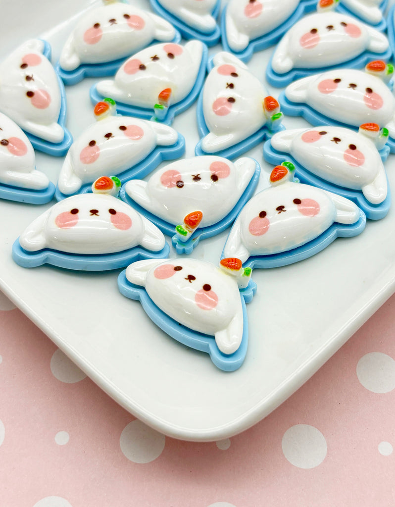 a white plate topped with lots of decorated cookies
