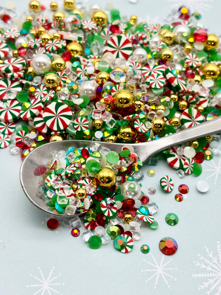 a spoon full of candy canes on a table