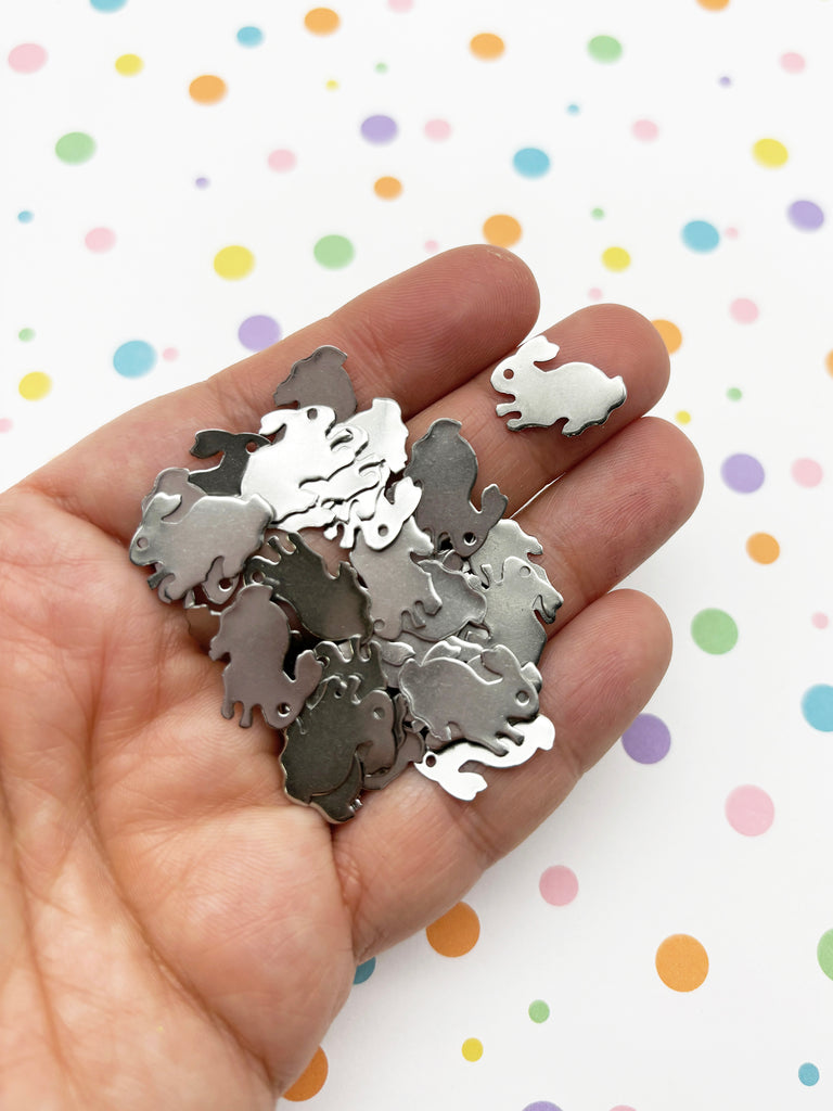 a person holding a bunch of metal pieces in their hand