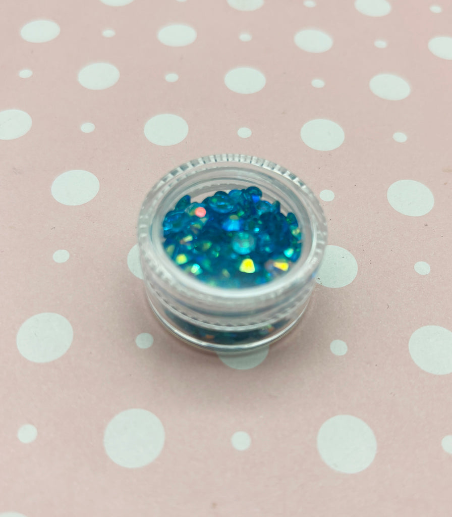 a close up of a small jar of glitter