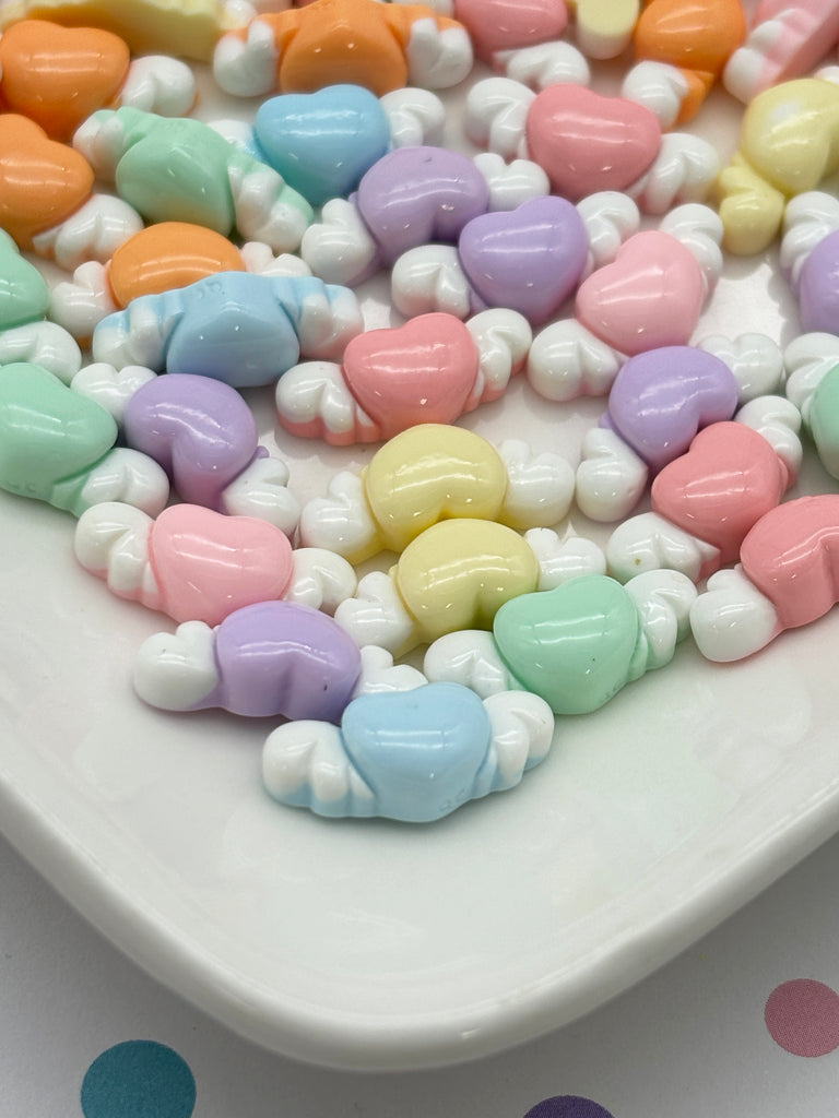 a white plate topped with candy hearts on top of a table