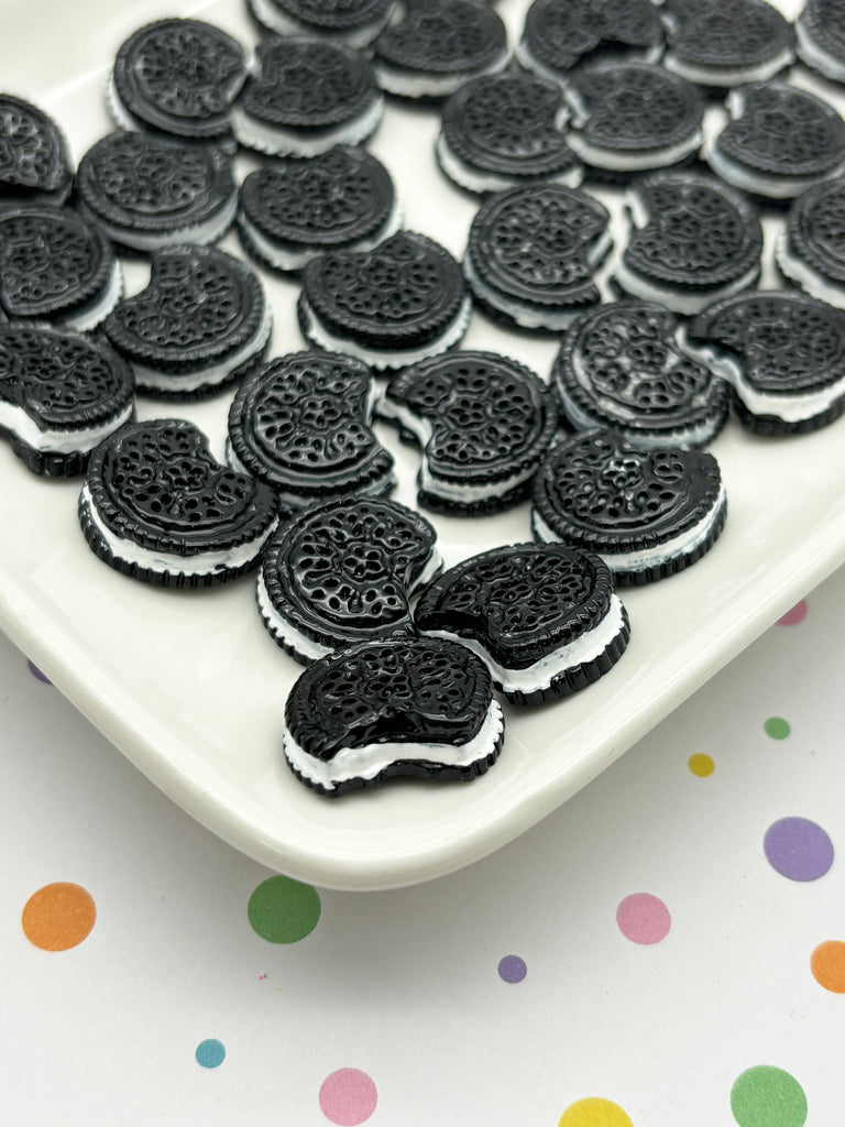 a plate of oreo cookies on a polka dot tablecloth