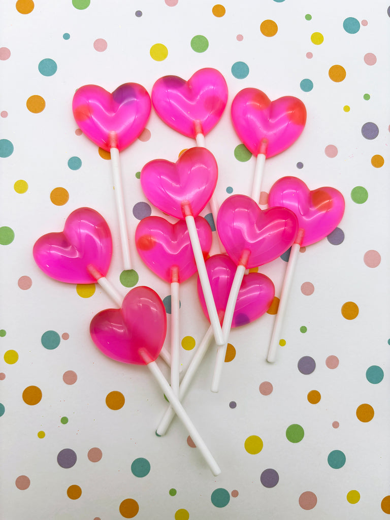 a bunch of lollipops that are shaped like hearts