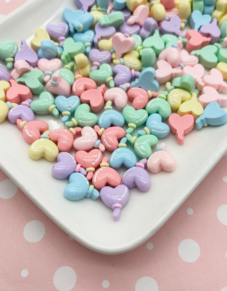a white plate topped with lots of candy hearts