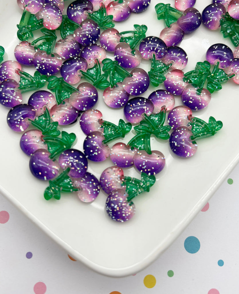 a white plate topped with lots of purple and green candies