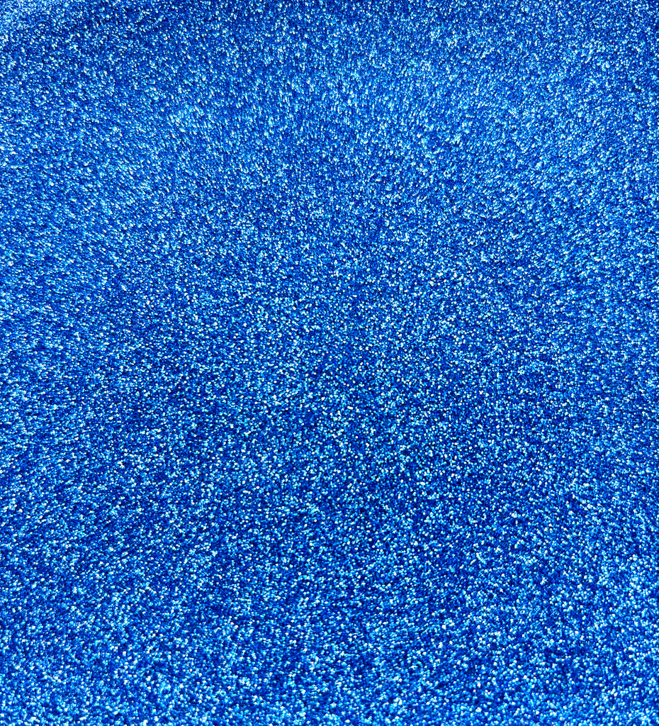 a close up of a blue carpet textured with glitter