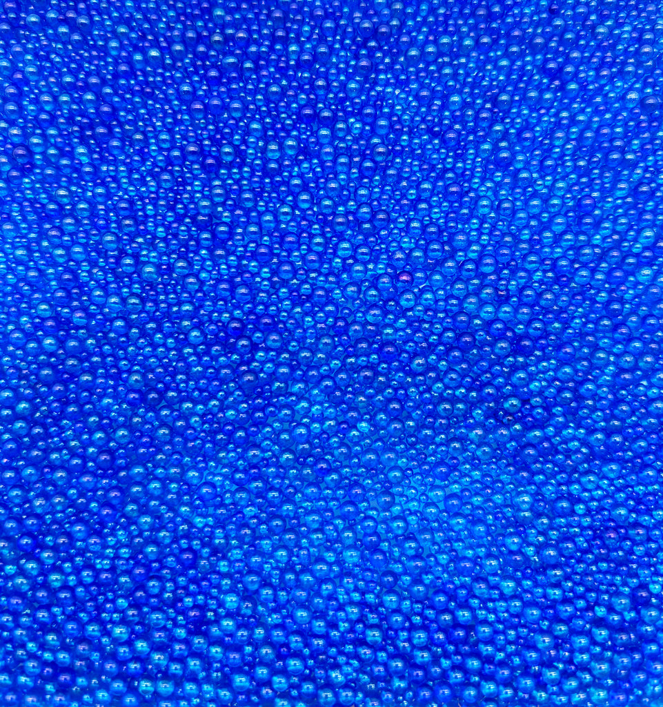 a close up of a blue background with bubbles