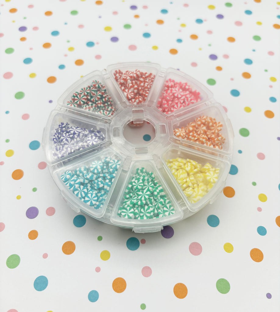 a plastic container filled with lots of colorful beads