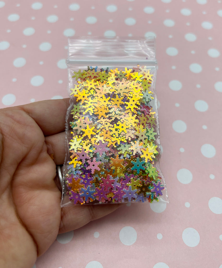 a person holding a bag of colorful confetti