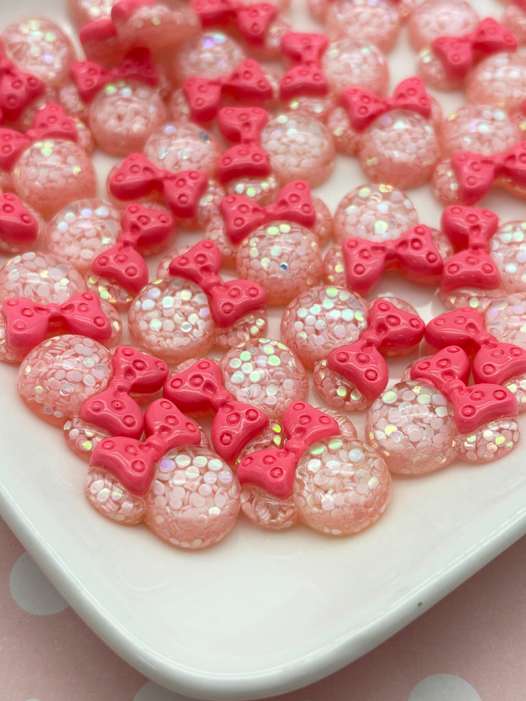 a white plate topped with lots of pink cookies
