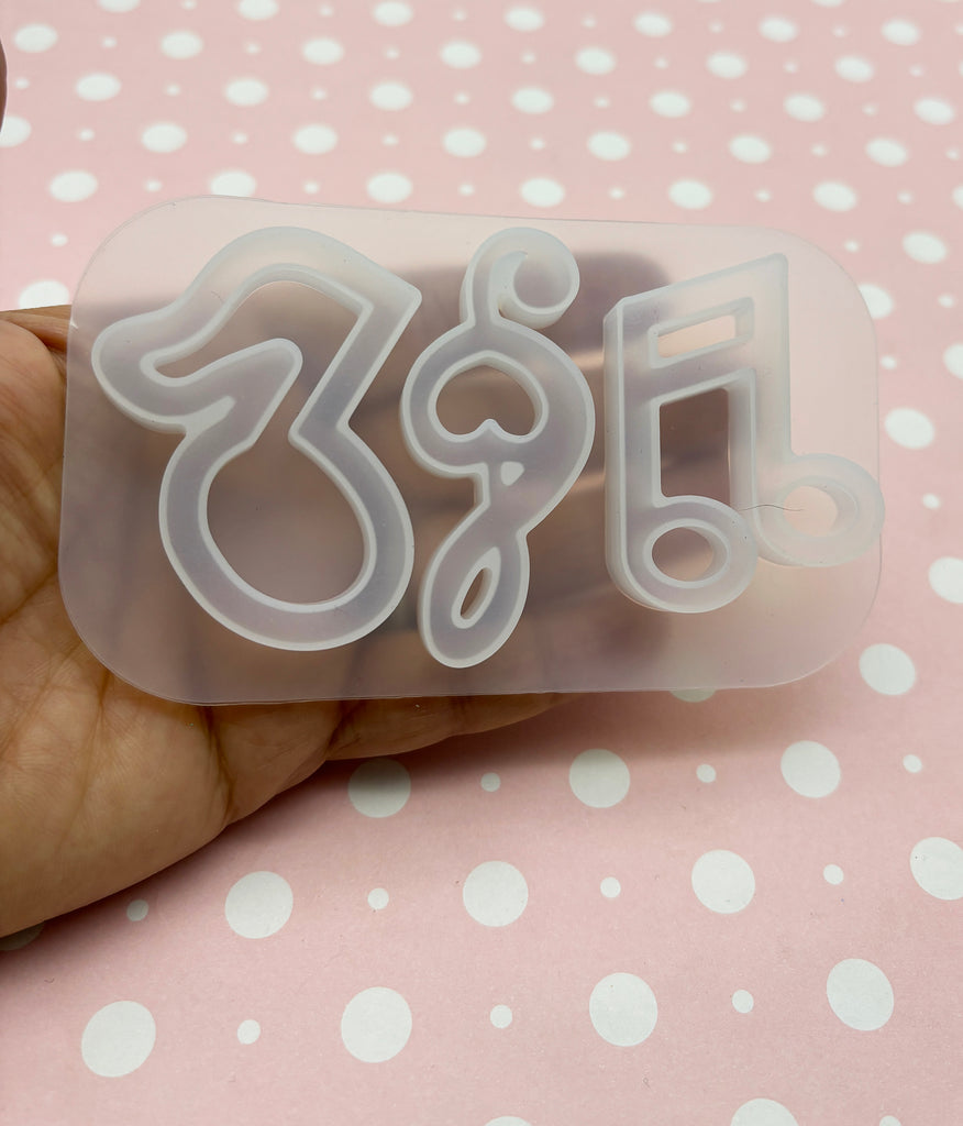 a person holding a plastic object with the number thirty five on it