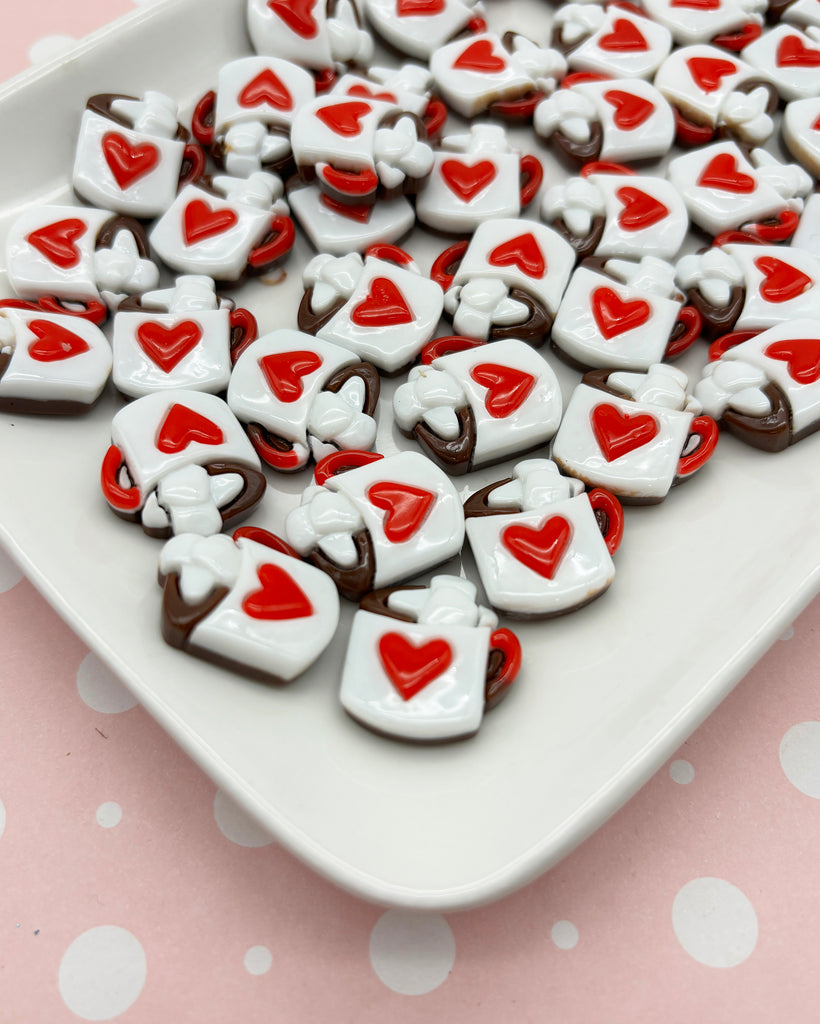 a white plate topped with lots of heart shaped cookies