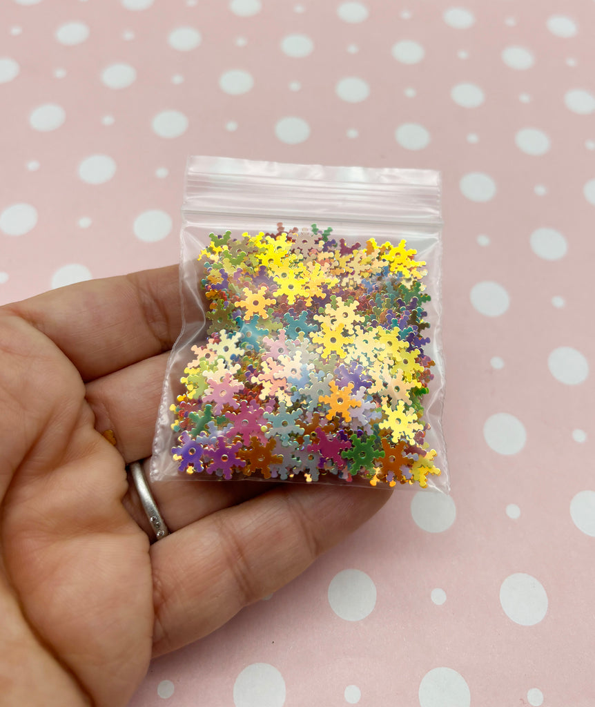 a person holding a bag of colorful confetti
