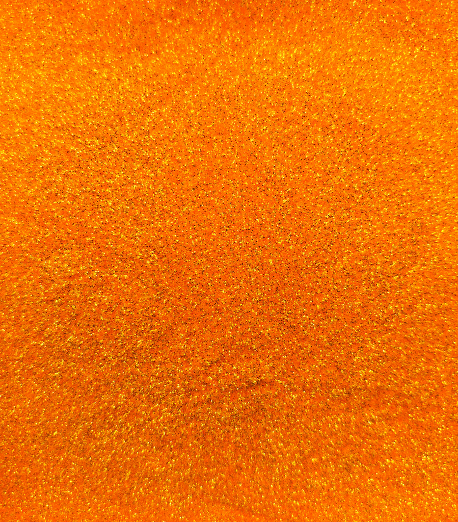 a close up of a bright orange background