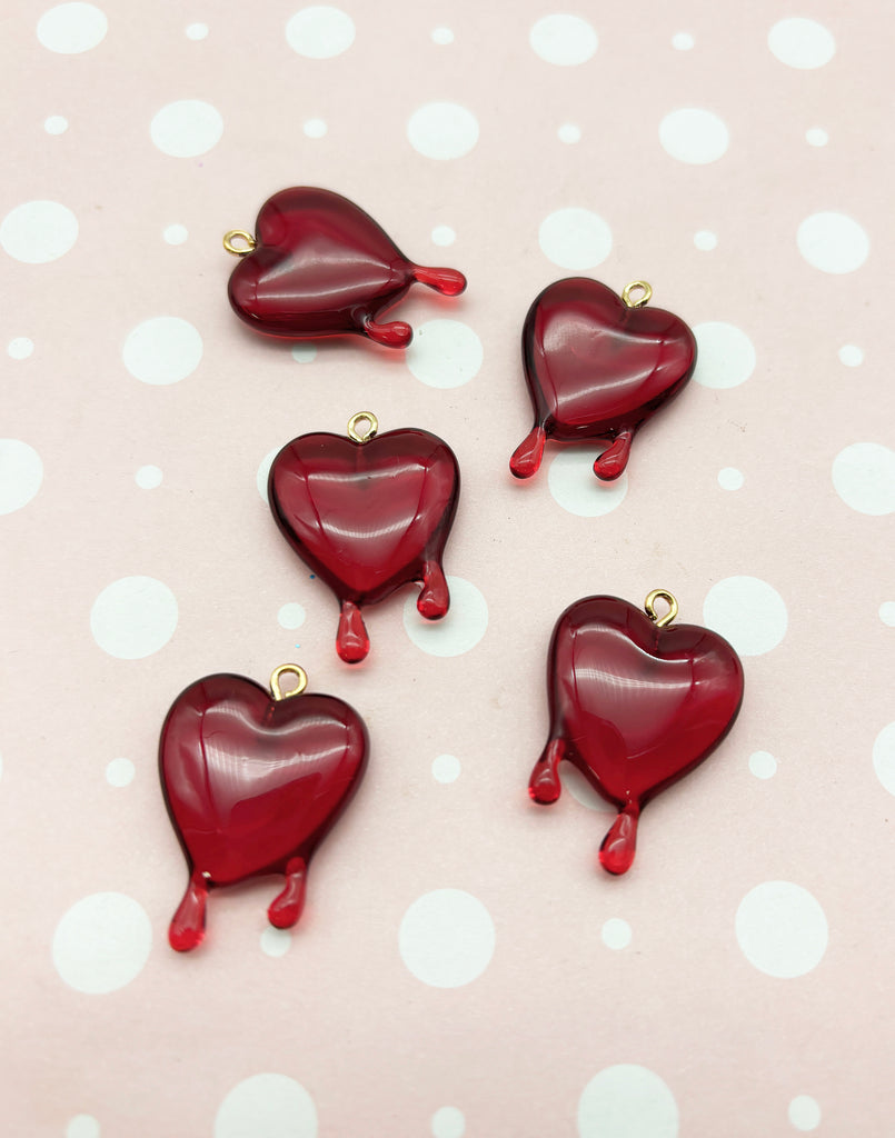 a group of red hearts sitting on top of a table