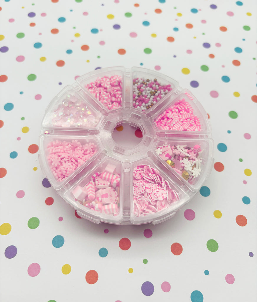 a plastic container filled with lots of pink sprinkles