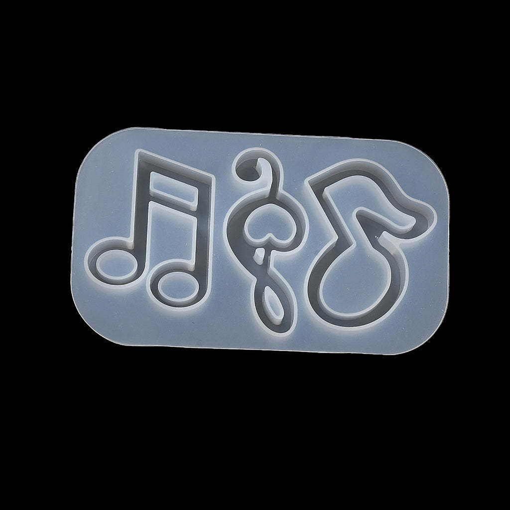 a rubber stamp with a musical note and treble