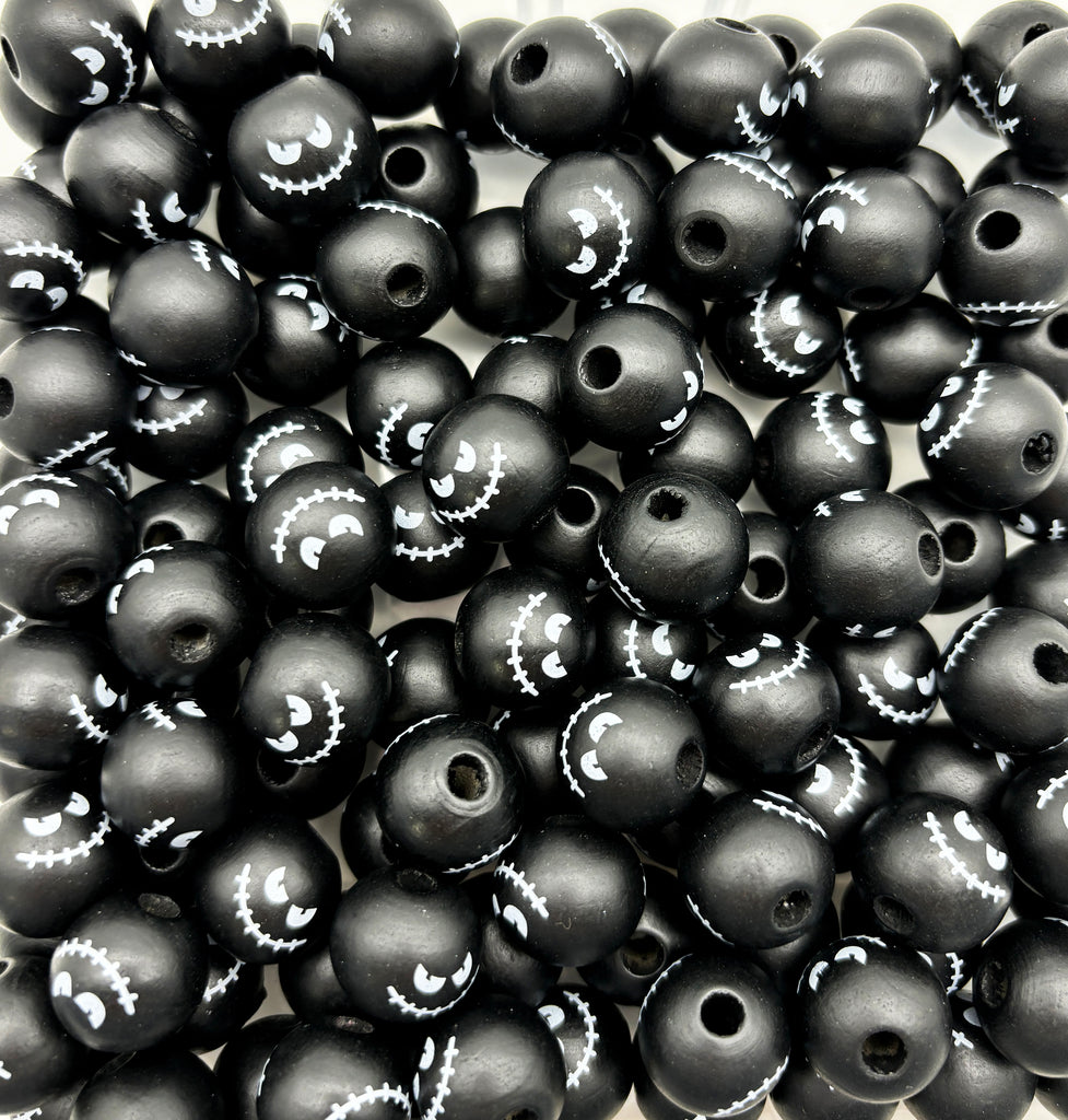 a pile of black beads sitting on top of a table