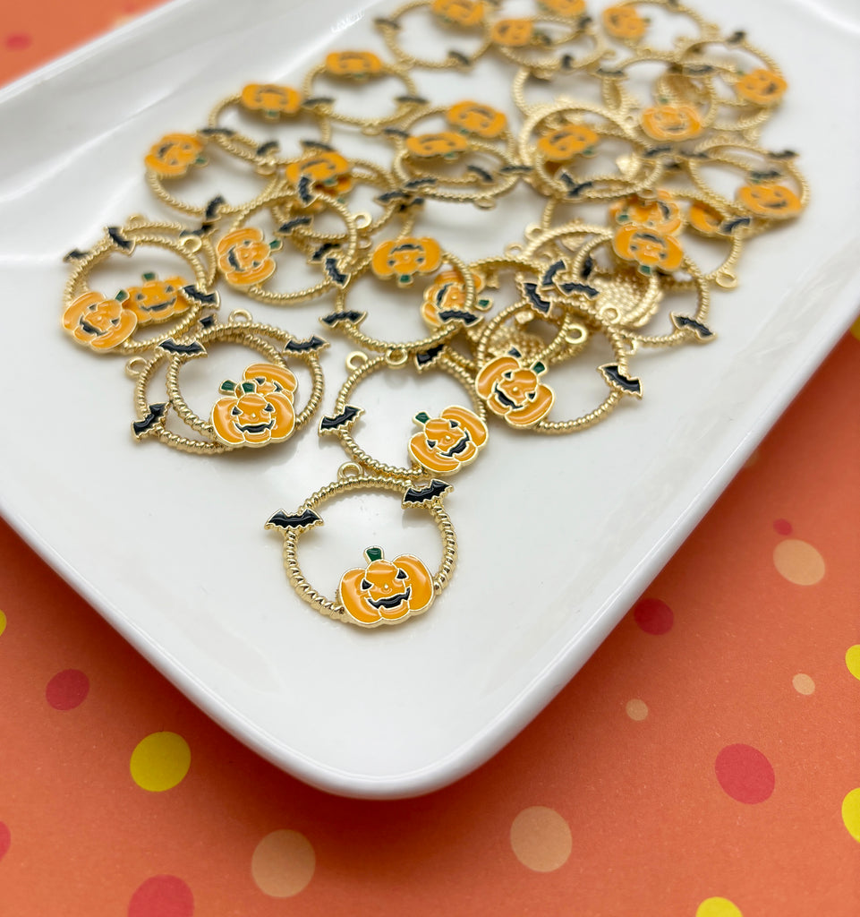 a white plate topped with lots of pumpkin charms