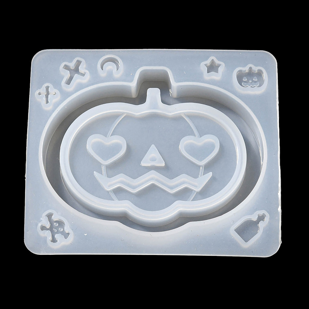 a cookie cutter with a carved pumpkin on it