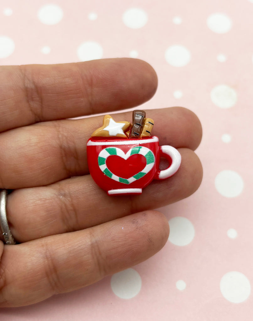 a miniature cup of coffee with a star on top of it