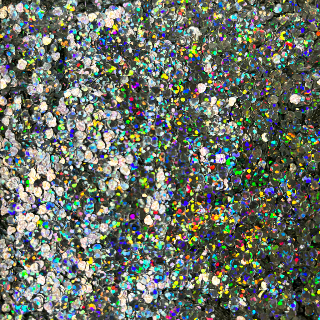 a large amount of confetti sprinkles on a black background