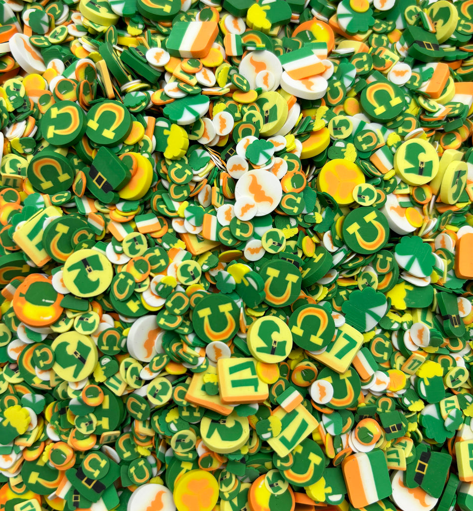 a pile of green and yellow buttons with numbers on them