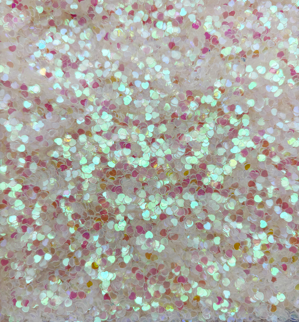 a close up of a cell phone with glitter on it