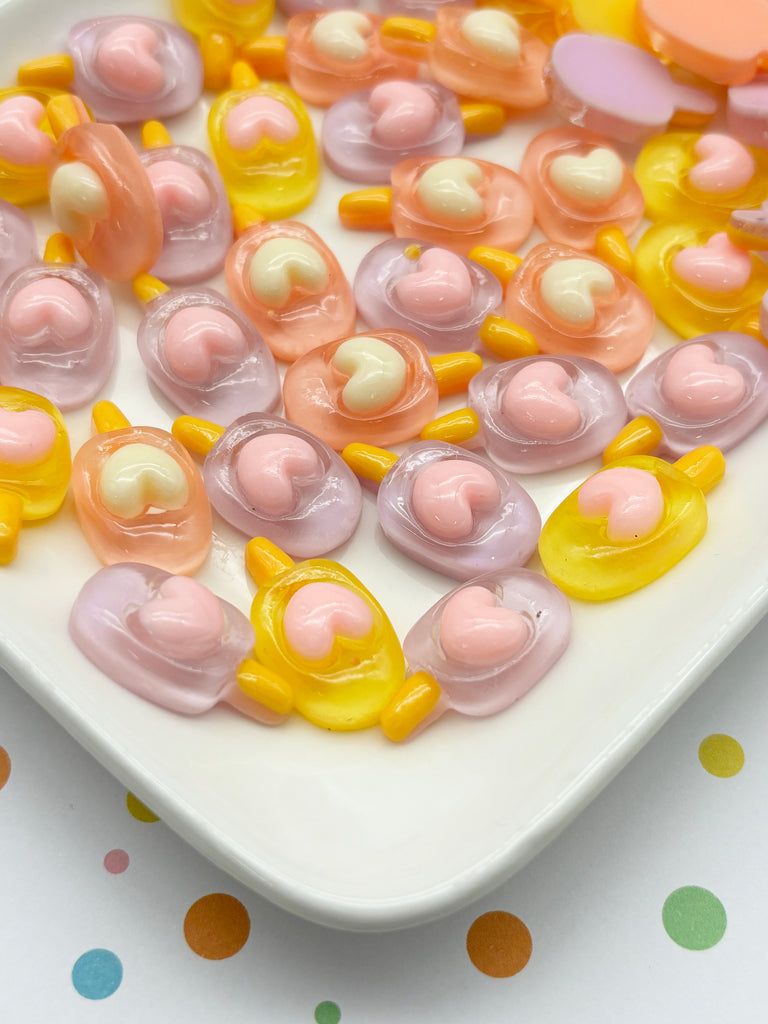 a white plate topped with lots of candy candies