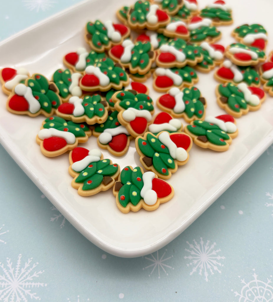 a plate of decorated christmas cookies on a table