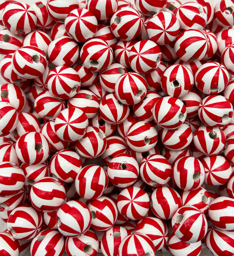 a pile of red and white striped balls