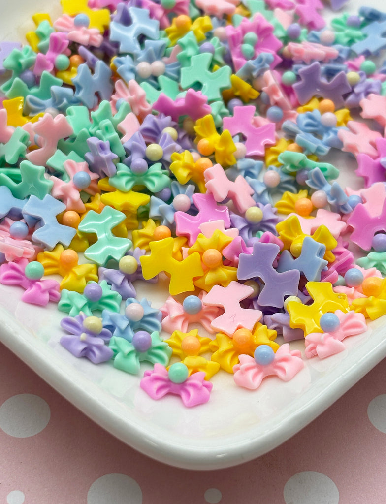 a white plate topped with lots of colorful stars