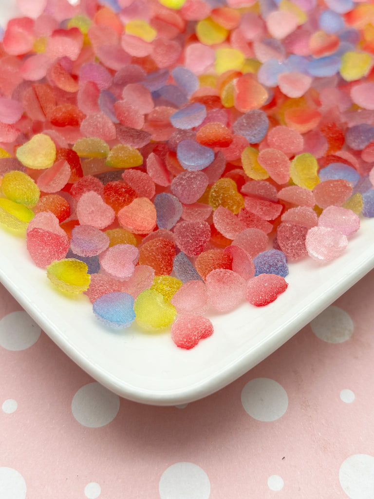 a white plate topped with lots of gummy bears