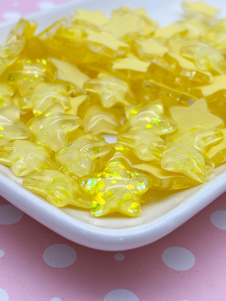 a white plate topped with yellow stars on top of a table