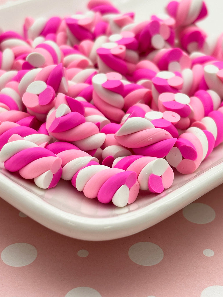 a white plate topped with pink and white hearts