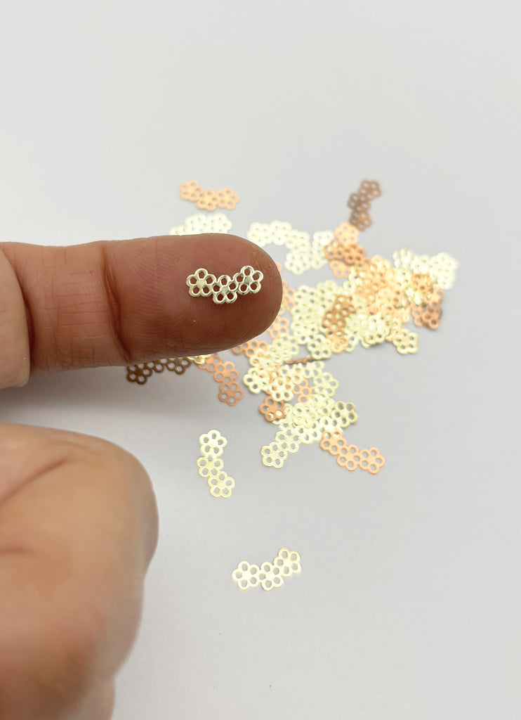 a finger is pointing at a bunch of tiny dots