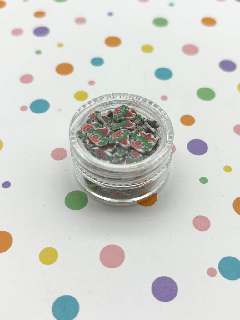 a small jar of confetti sitting on top of a table