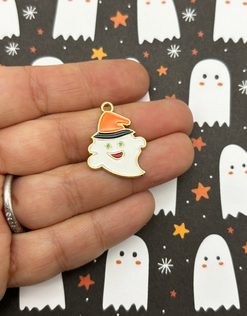 a person wearing a halloween hat and holding a charm
