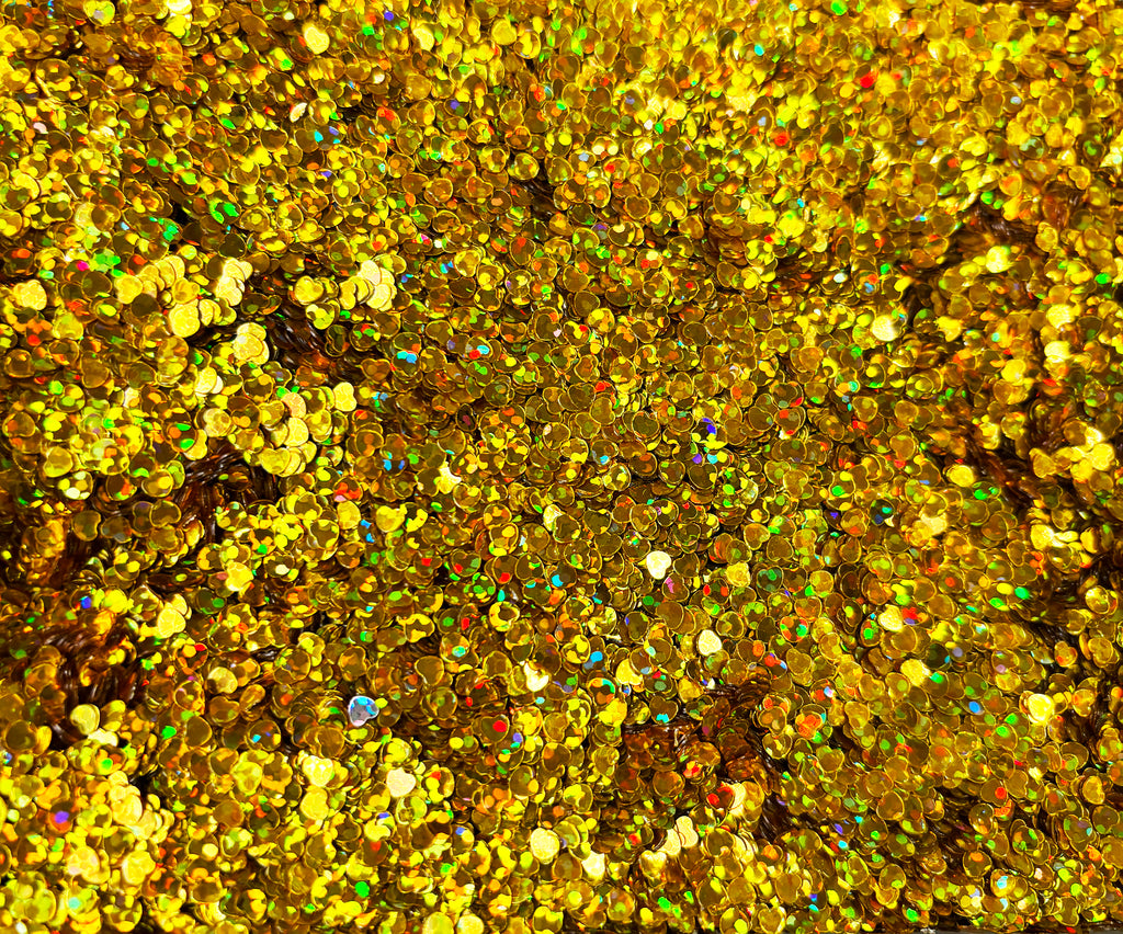 a close up of a bunch of gold glitter