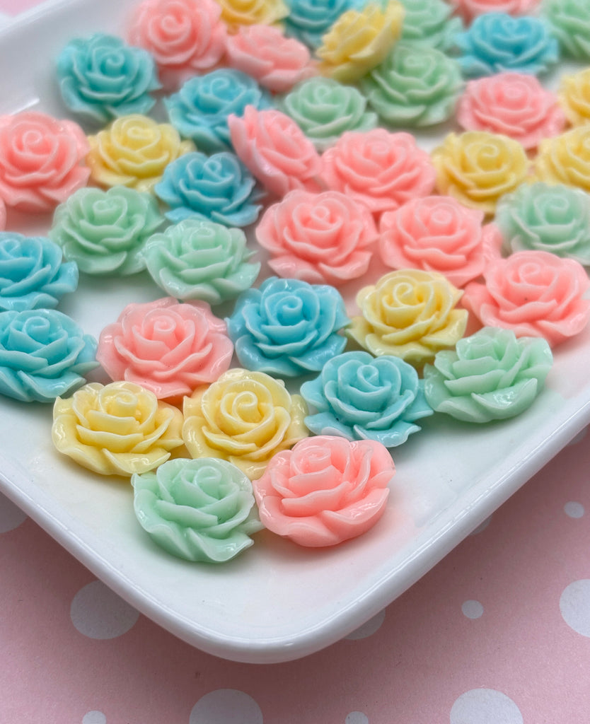 a white plate topped with lots of colorful cupcakes