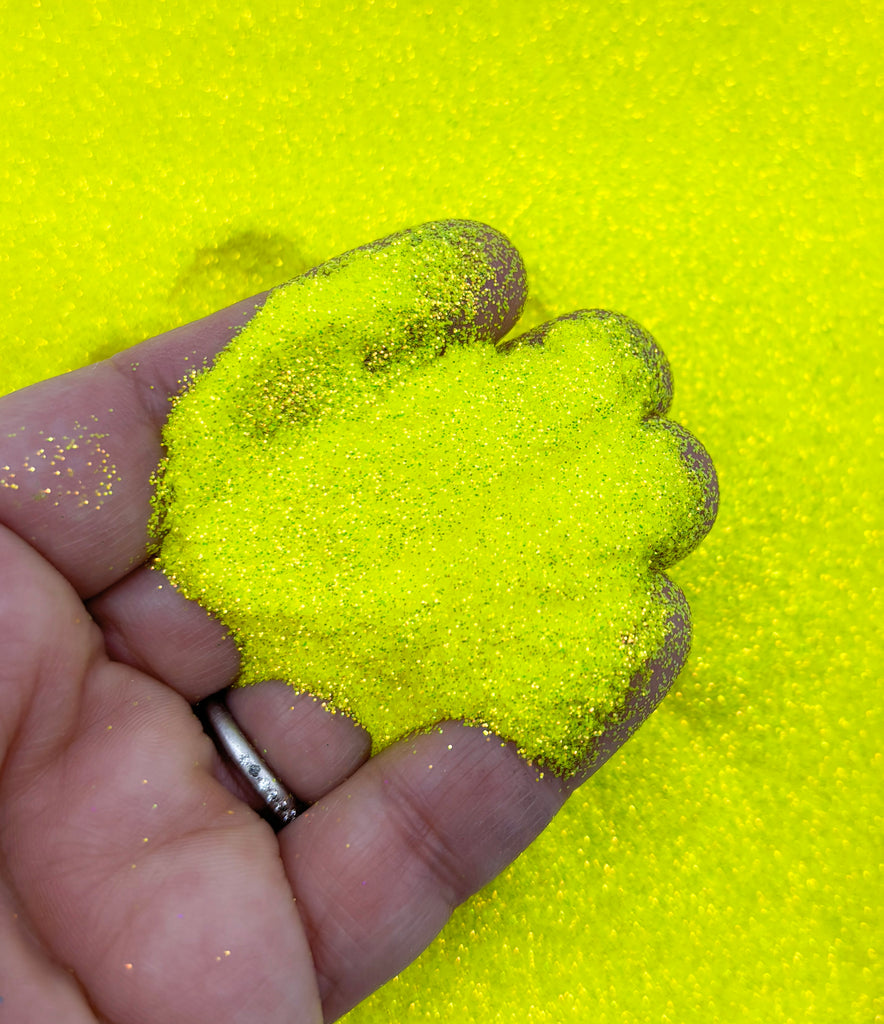 a person holding a yellow substance in their hand