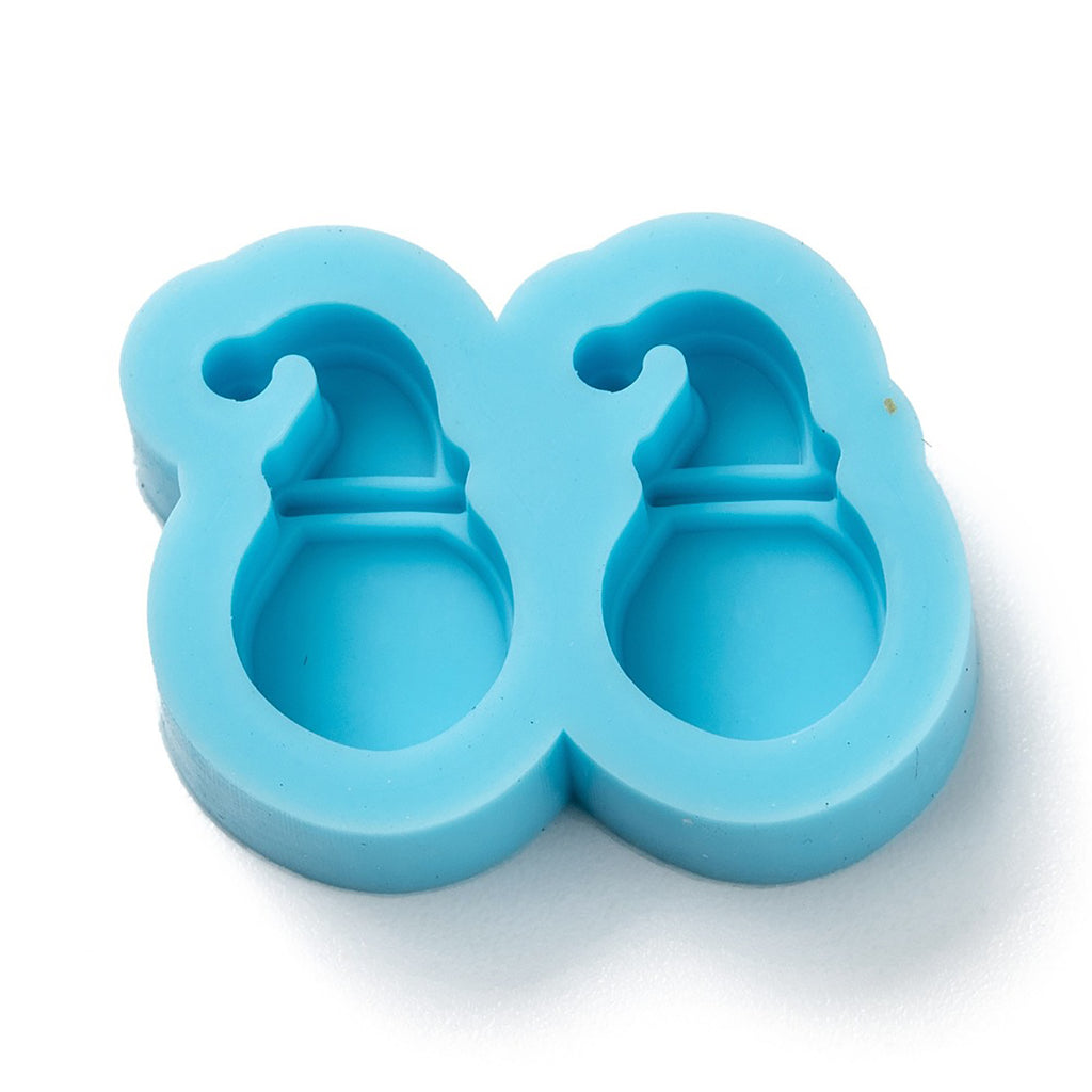 a blue cookie cutter with two holes in it