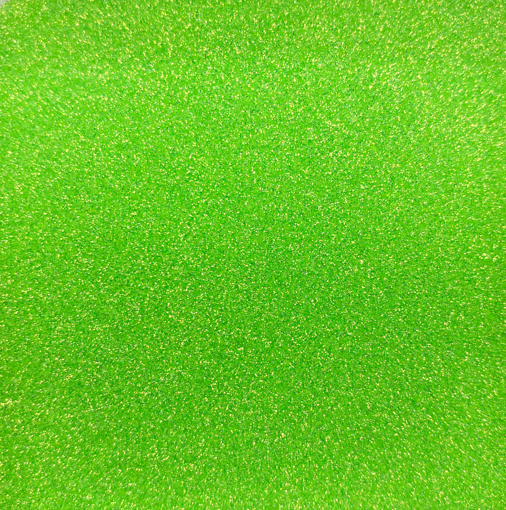 a close up of a bright green background